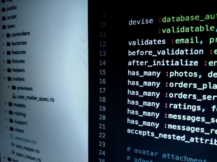 Code displayed on a computer screen with security icons overlay