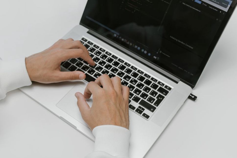close-up of a YubiKey plugged into a laptop during cryptocurrency account setup