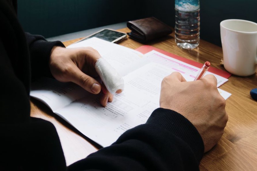 Writing down 12-word seed phrase for cryptocurrency wallet backup