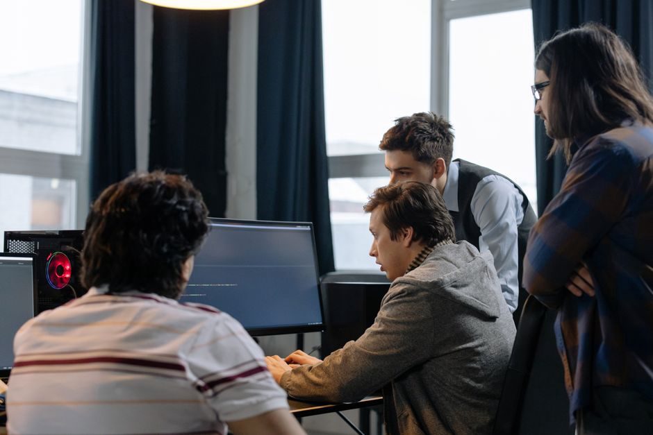 Team of programmers collaborating on a code review session