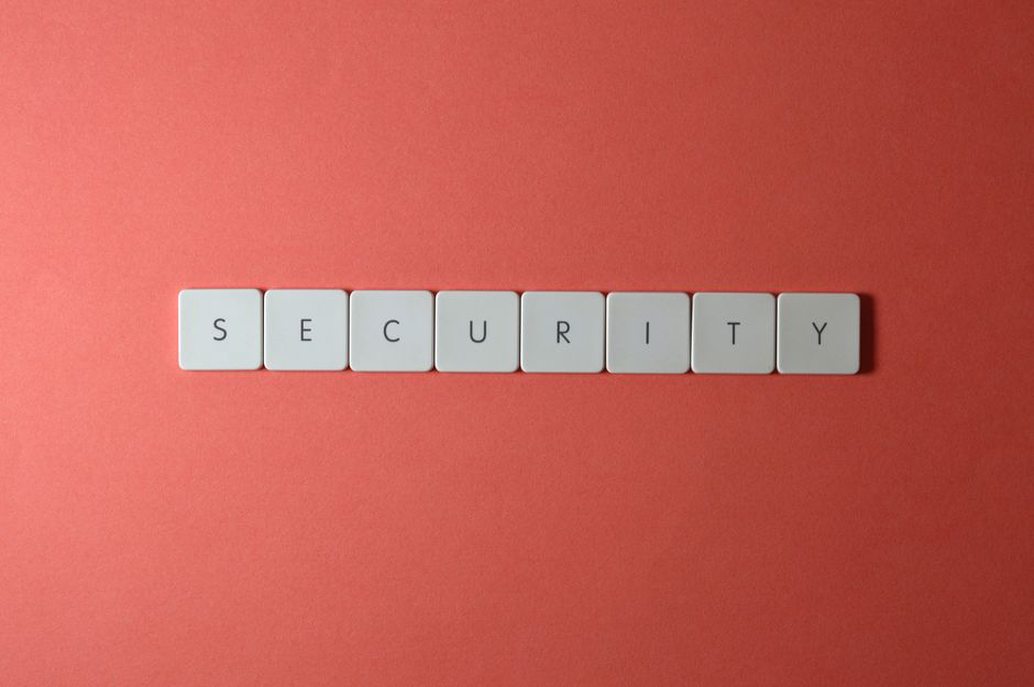 person typing secure password on laptop