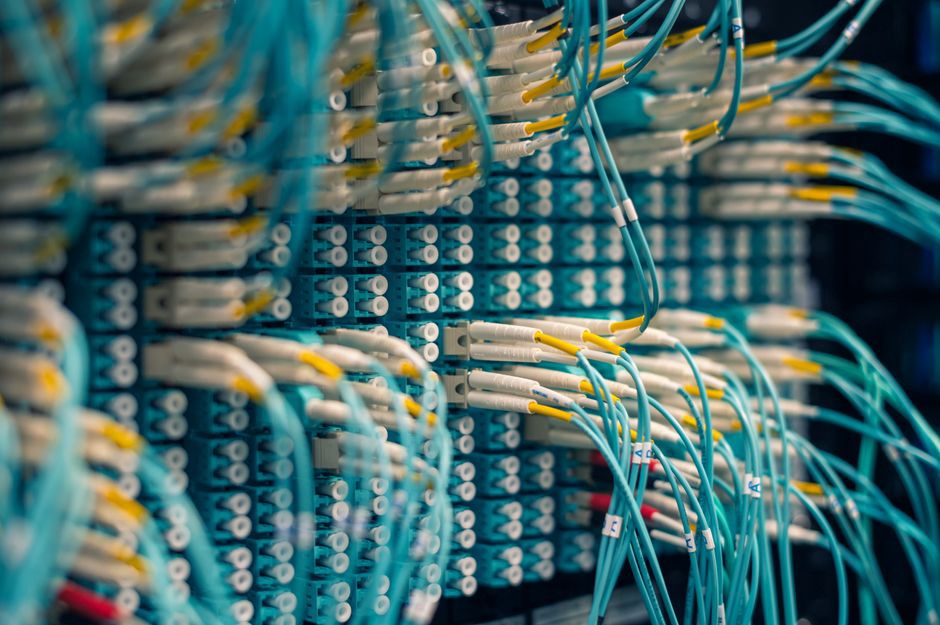 A server room with organized network cables and blinking lights