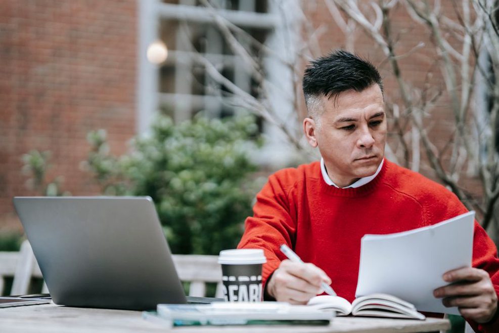 A focused outline beside a laptop
