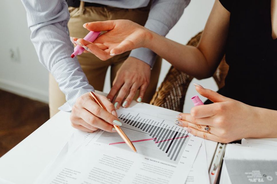 Colleagues check figures before publishing a case study